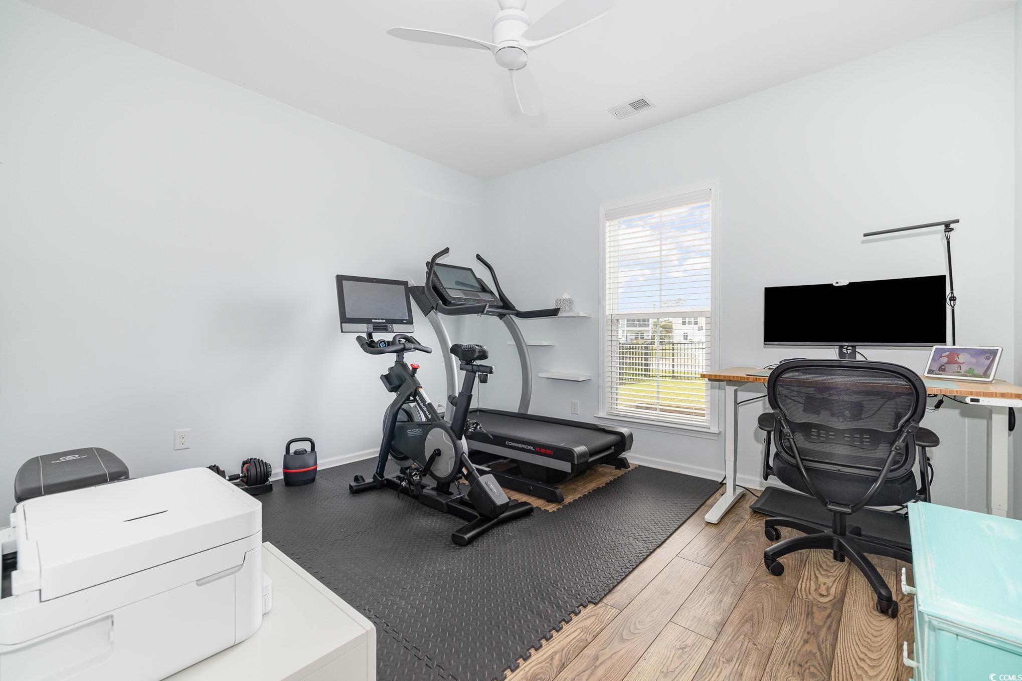 136 Splendor Circle Murrells Inlet, SC 29576 - Photo 18 of 30 Workout room featuring a ceiling fan, visible vents, baseboards, and wood finished floors
