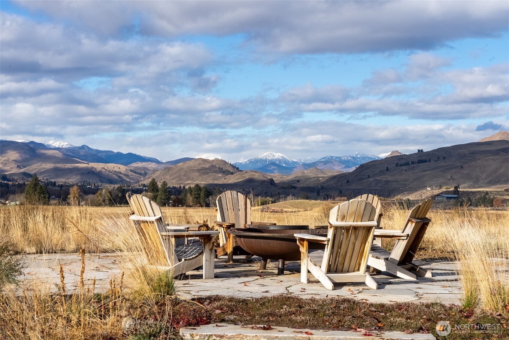 48 Thurlow Road Twisp, WA 98856 - Photo 17 of 40 a view of a swimming pool with a table and chairs