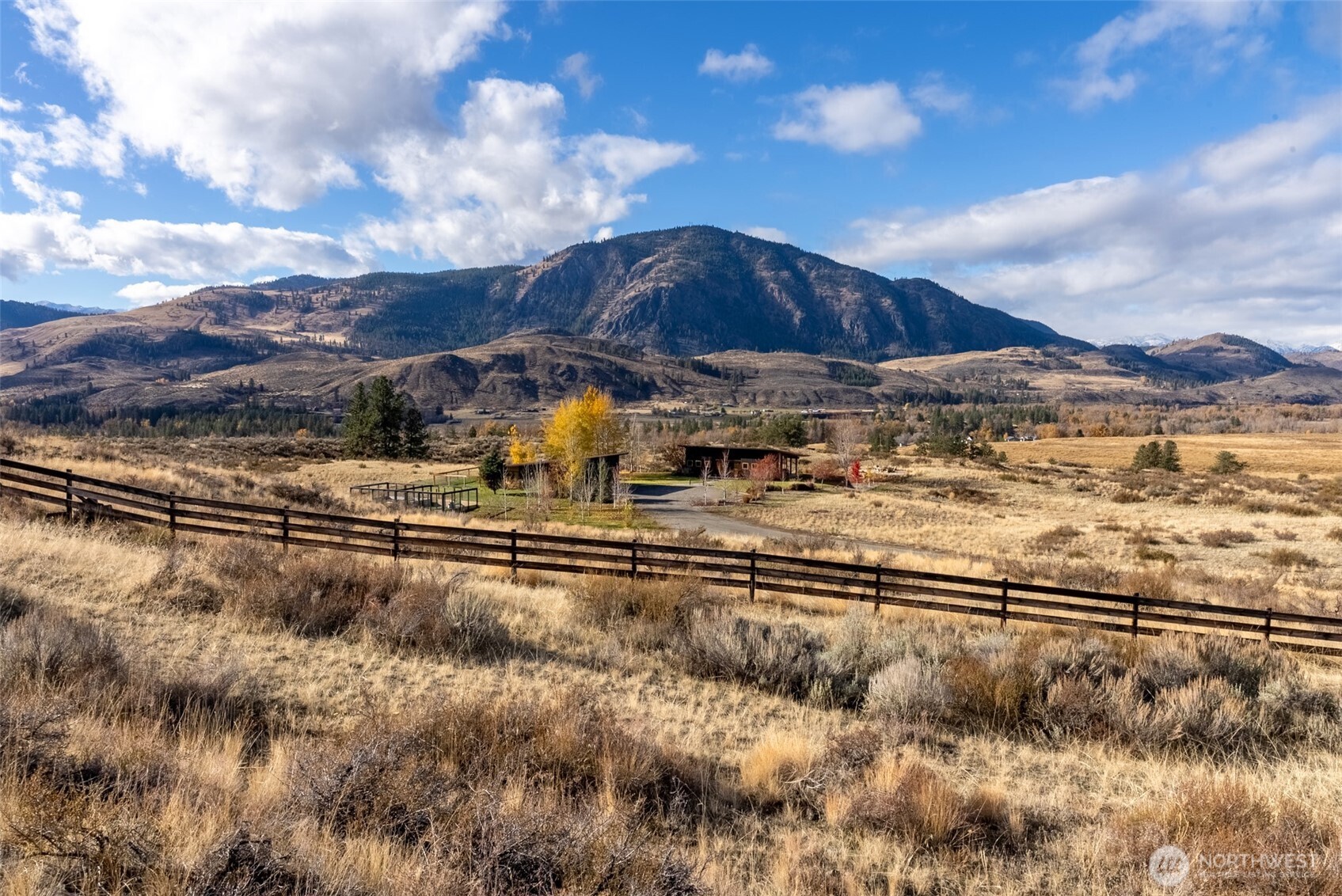 48 Thurlow Road Twisp, WA 98856 - Photo 2 of 40 a view of a yard with wooden fence