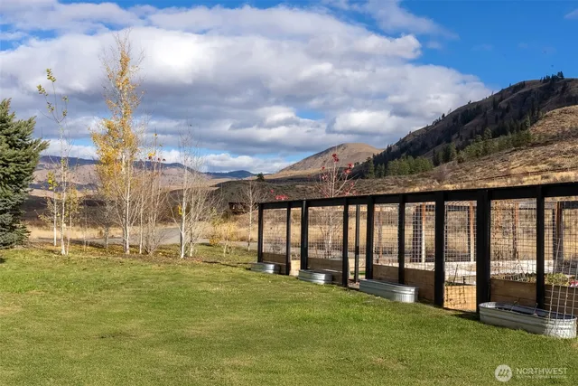 a swimming pool with a yard in front of it