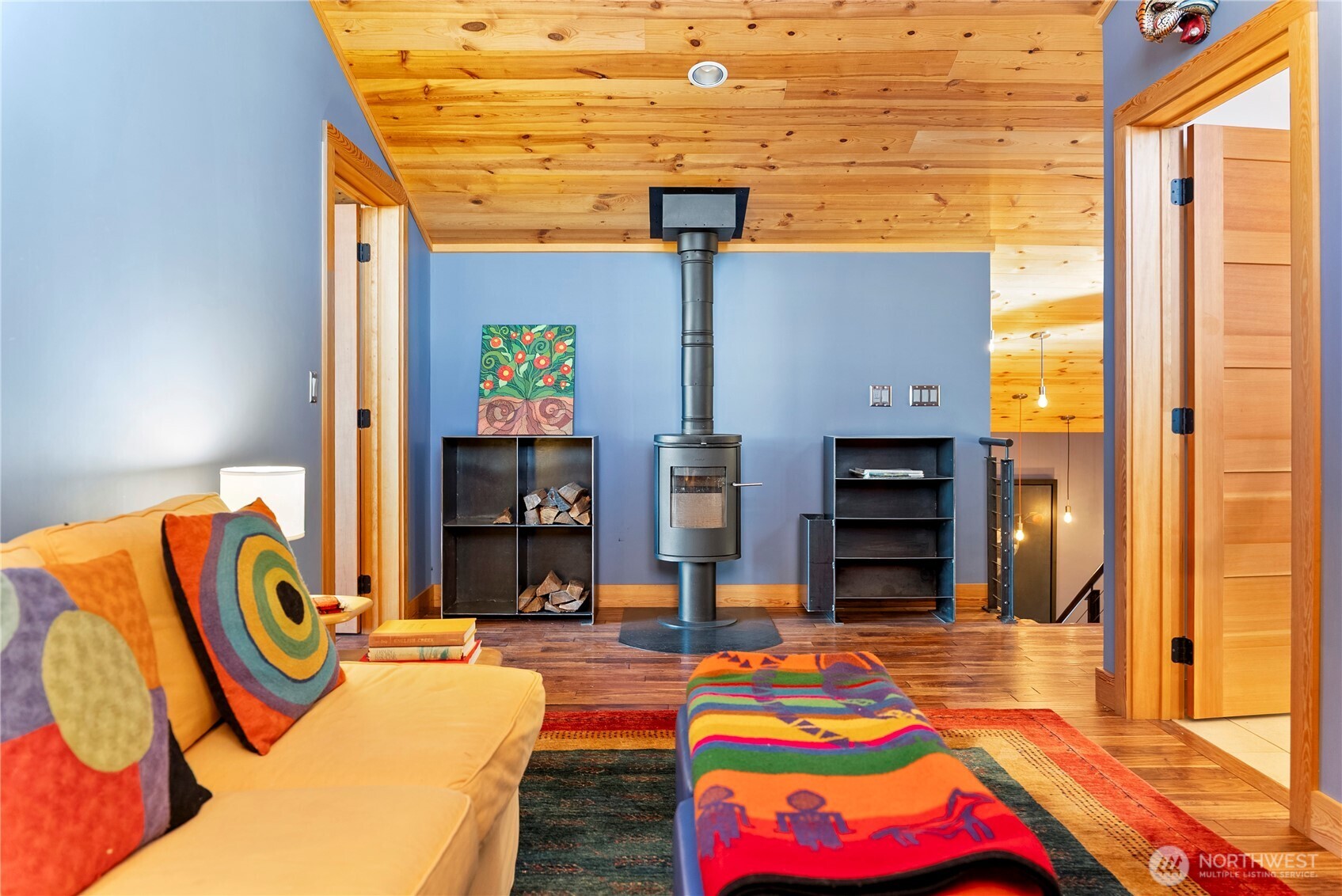 48 Thurlow Road Twisp, WA 98856 - Photo 31 of 40 a bedroom with a bed and dresser with wooden floor