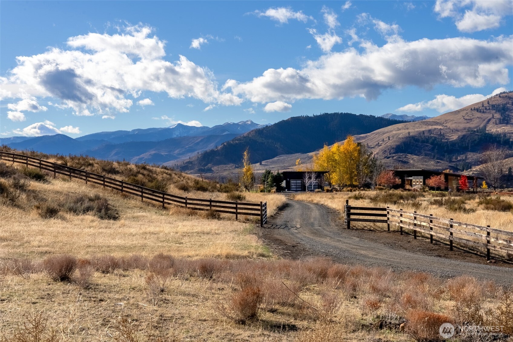 48 Thurlow Road Twisp, WA 98856 - Photo 4 of 40 a view of a terrace with a wooden fence