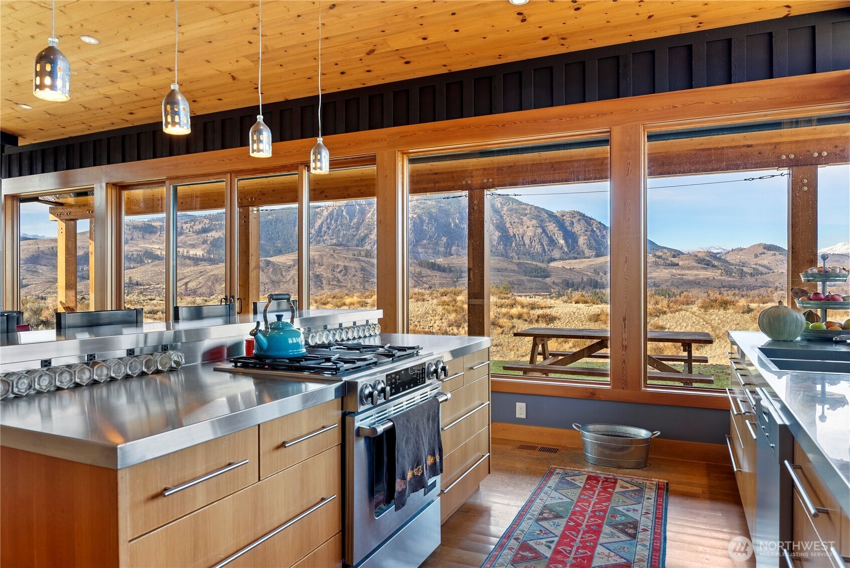 48 Thurlow Road Twisp, WA 98856 - Photo 10 of 40 a kitchen with stainless steel appliances granite countertop a stove a sink and a cabinets