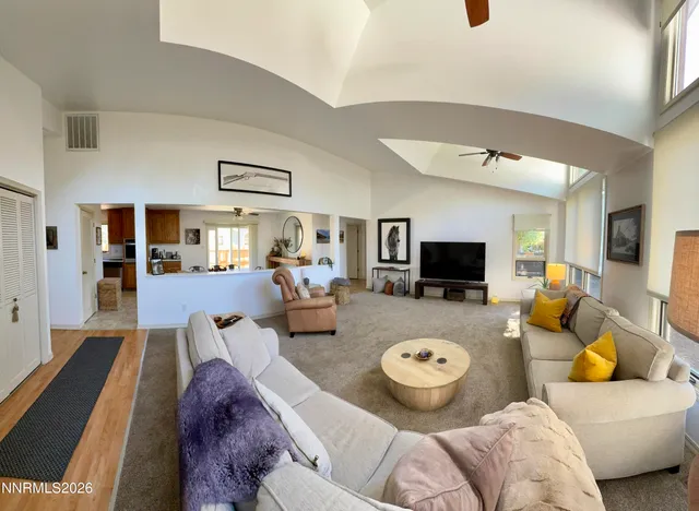 a kitchen with stainless steel appliances a stove microwave and cabinets