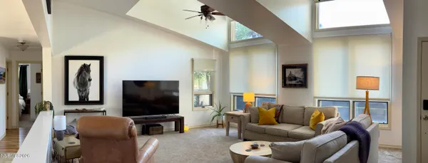 a bathroom with a sink a toilet and shower a mirror