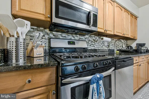 a kitchen with a stove and a microwave