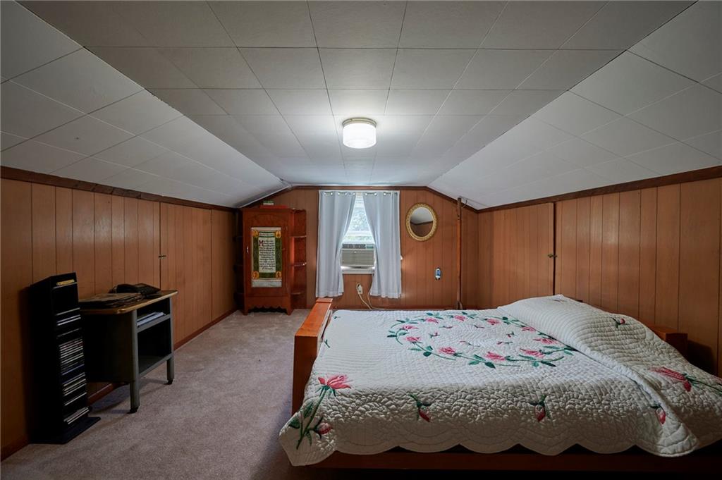 2583 Highway 210 Rural Valley, PA 16249 - Photo 17 of 41 a bedroom with a bed and a dresser with mirror
