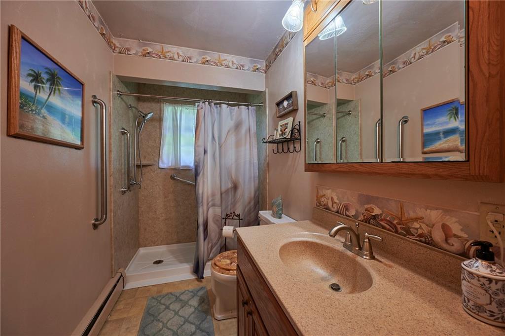 2583 Highway 210 Rural Valley, PA 16249 - Photo 19 of 41 a bathroom with a tub sink and mirror