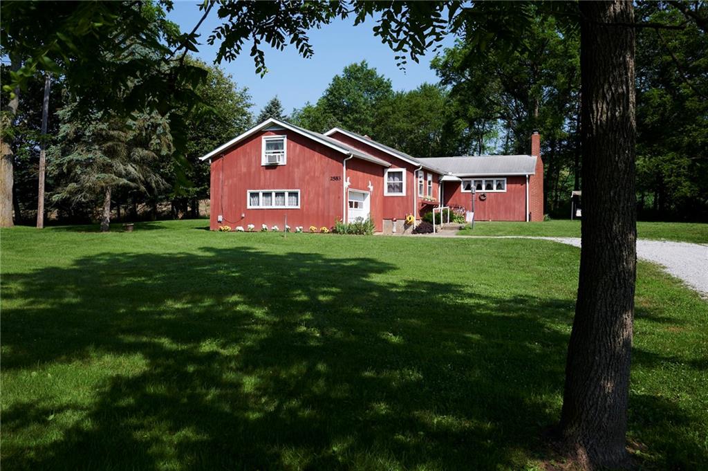 2583 Highway 210 Rural Valley, PA 16249 - Photo 20 of 41 a house with garden in front of it