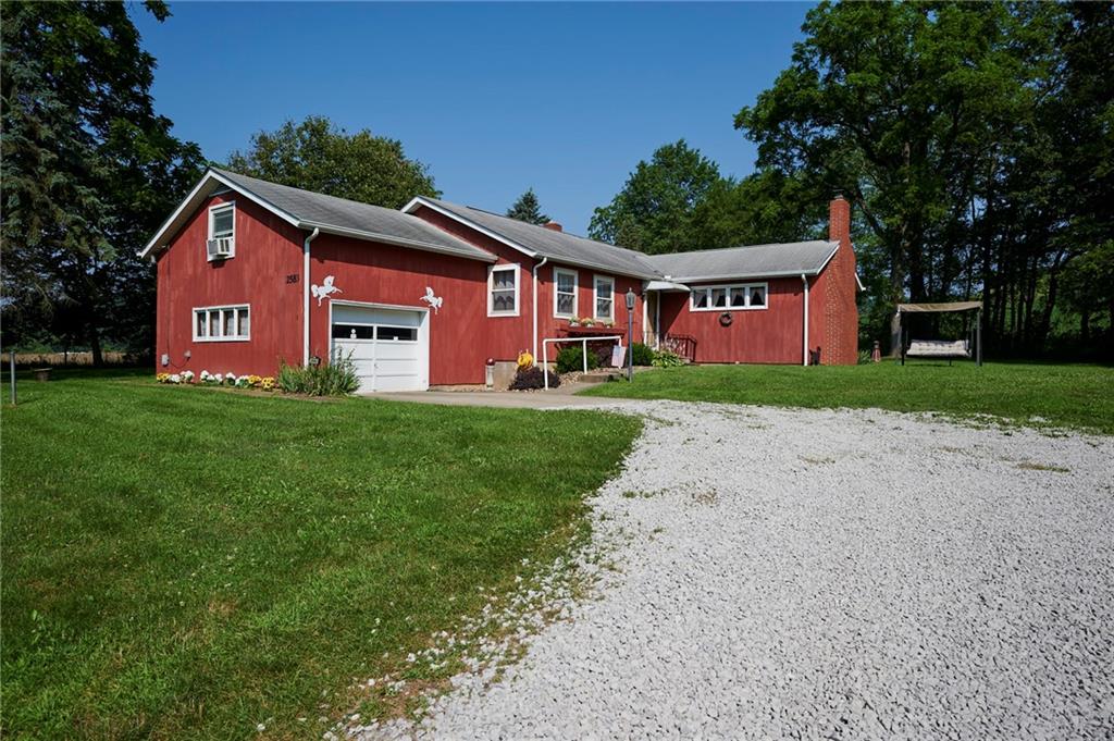 2583 Highway 210 Rural Valley, PA 16249 - Photo 2 of 41 a front view of a house with garden
