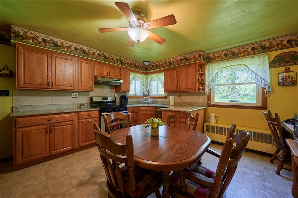 2583 Highway 210 Rural Valley, PA 16249 - Photo 9 of 41 a kitchen with a table chairs sink and cabinets
