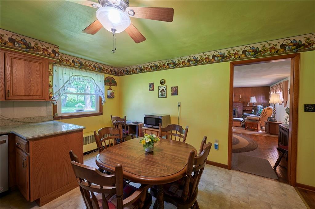 2583 Highway 210 Rural Valley, PA 16249 - Photo 10 of 41 a view of a dining room with furniture and a chandelier