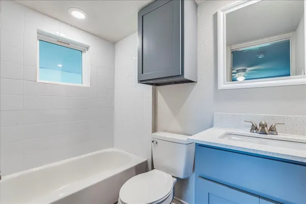 a bathroom with a sink toilet and bathtub