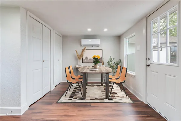 a view of a dining room with furniture window and wooden floor