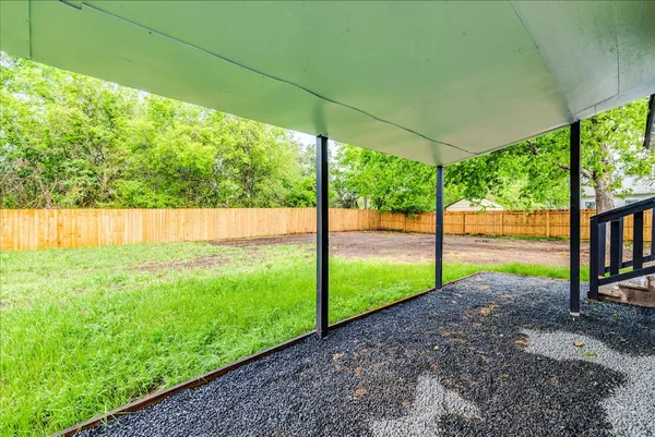 a view of backyard with green space