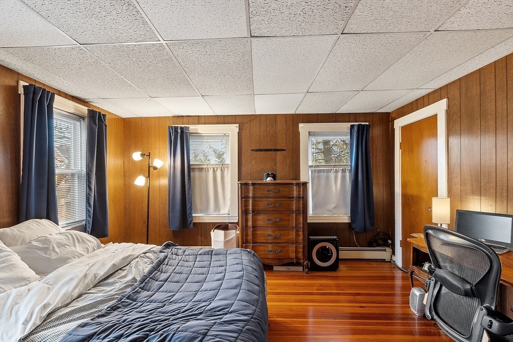 51 Crescent Street Wakefield, MA 01880 - Photo 12 of 20 a view of a bedroom with furniture and windows
