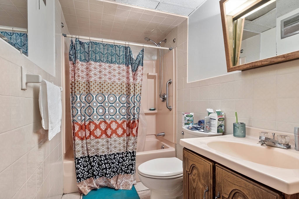 51 Crescent Street Wakefield, MA 01880 - Photo 17 of 20 a bathroom with a sink toilet and shower