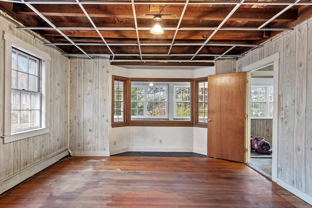 51 Crescent Street Wakefield, MA 01880 - Photo 4 of 20 a view of an empty room with wooden floor and windows