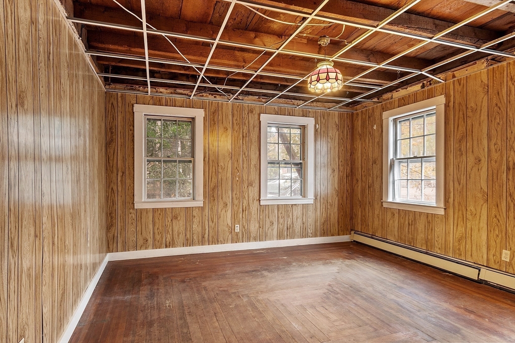 51 Crescent Street Wakefield, MA 01880 - Photo 5 of 20 an empty room with wooden floor and windows