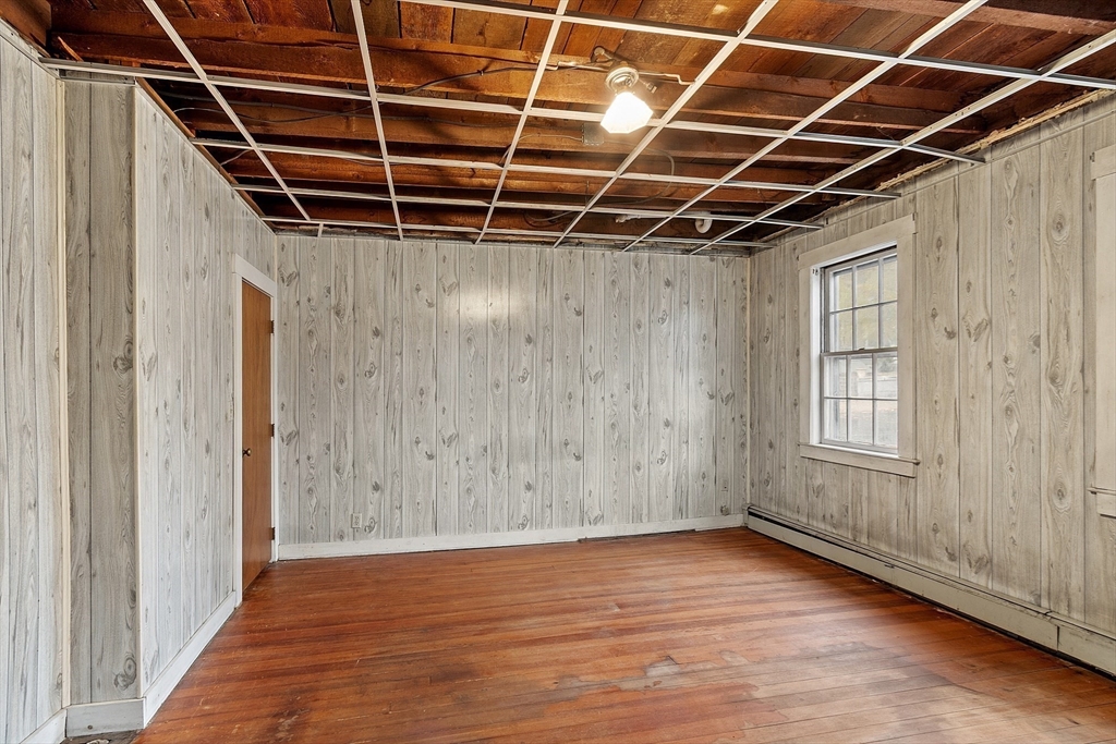 51 Crescent Street Wakefield, MA 01880 - Photo 6 of 20 a view of an empty room with wooden floor and a window