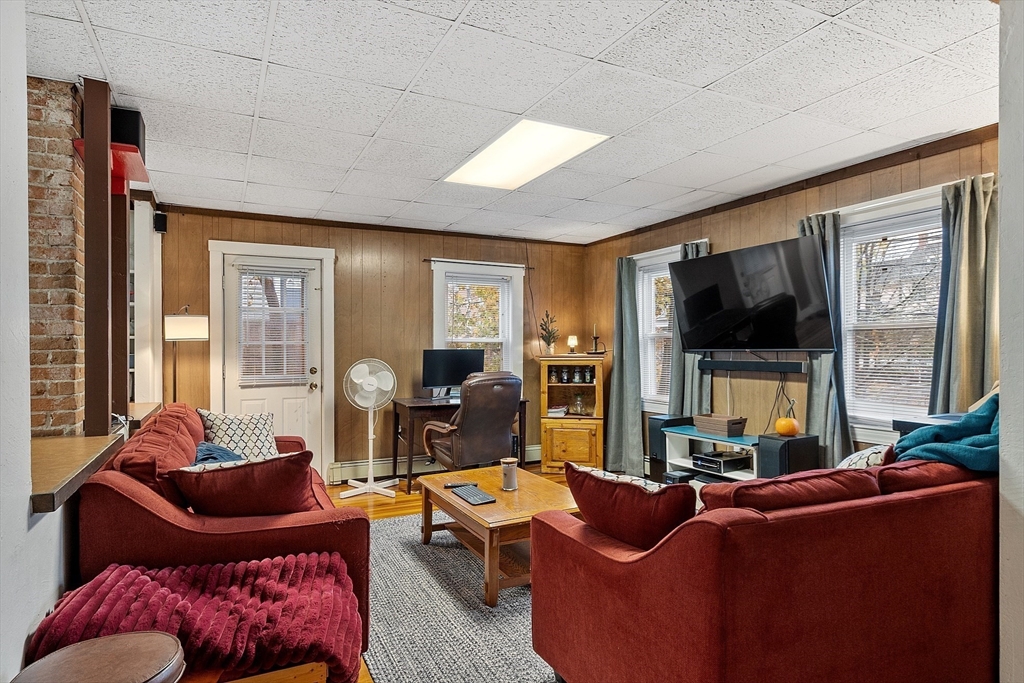 51 Crescent Street Wakefield, MA 01880 - Photo 10 of 20 a living room with furniture and a flat screen tv