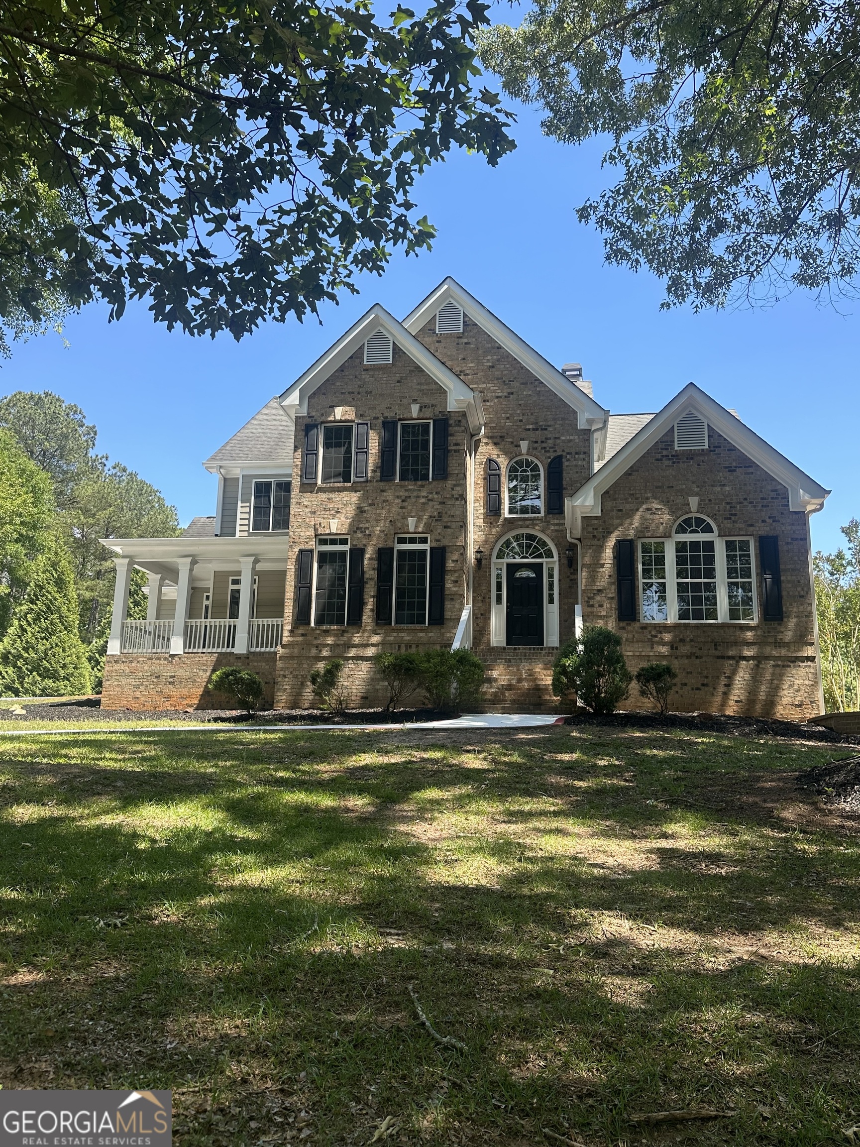 65 Spratlin Way Hull, GA 30646 - Photo 35 of 35 a front view of a house with a garden