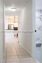 911 Northeast 199th Street, Unit 10414 Miami, FL 33179 - Photo 11 of 18 a bathroom with a sink a toilet and mirror