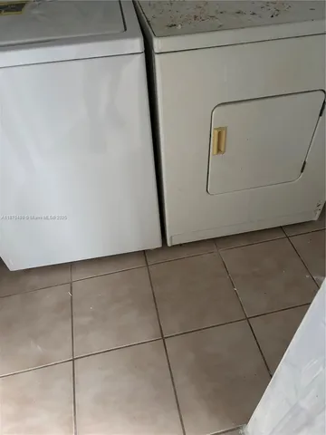 a view of a house with backyard porch and sitting area