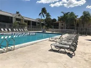a view of a street with a building and a street sign