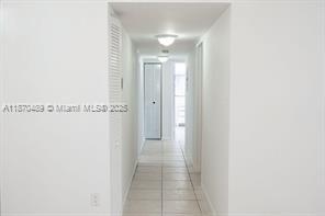 911 Northeast 199th Street, Unit 10414 Miami, FL 33179 - Photo 10 of 18 a view of a hallway