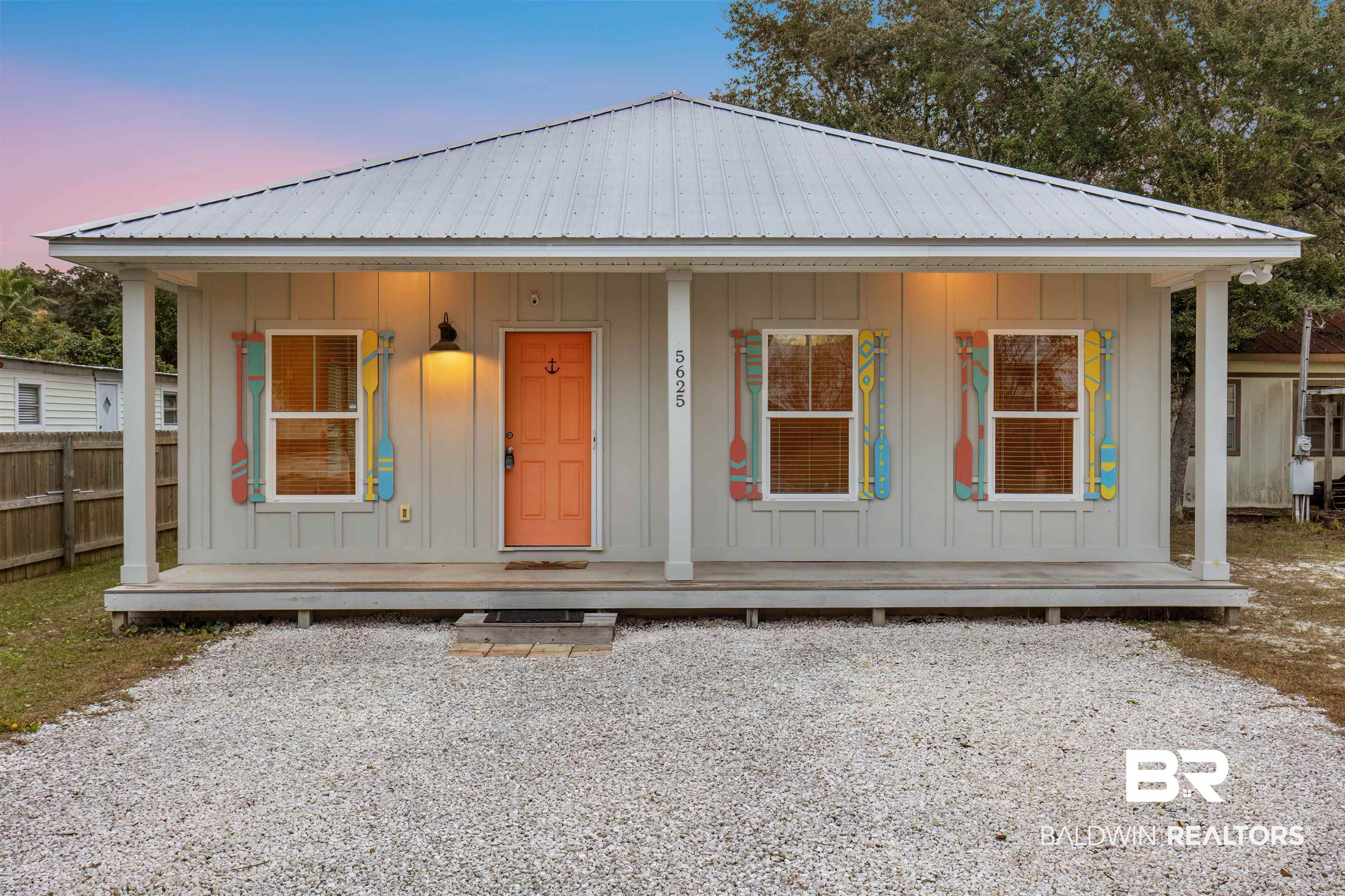5625 Georgia Street Orange Beach, AL 36561 - Photo 1 of 30 View of front facade with a porch
