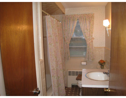 110 School Street Lexington, MA 02421 - Photo 9 of 15 a bathroom with a granite countertop sink and a mirror
