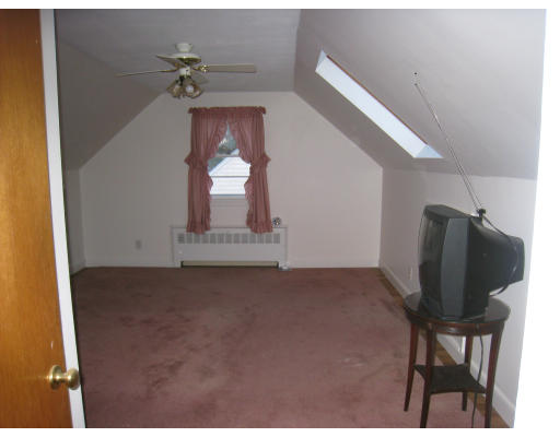 110 School Street Lexington, MA 02421 - Photo 10 of 15 a view of a livingroom with furniture and a window