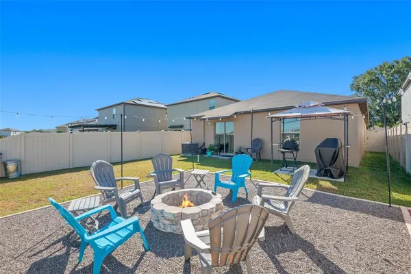 swimming pool view with a seating space