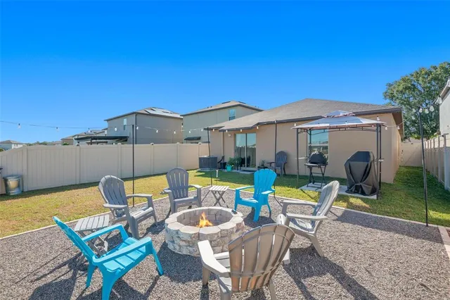 swimming pool view with a seating space