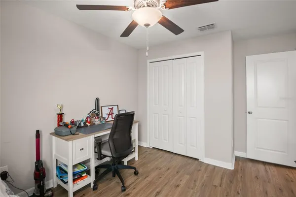 a workspace with furniture and wooden floor