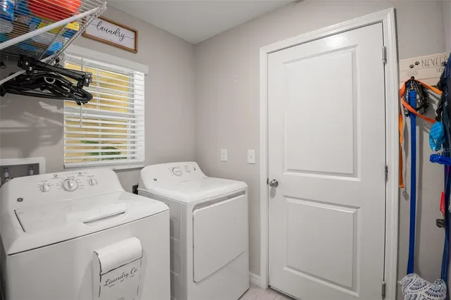 a utility room with dryer and washer