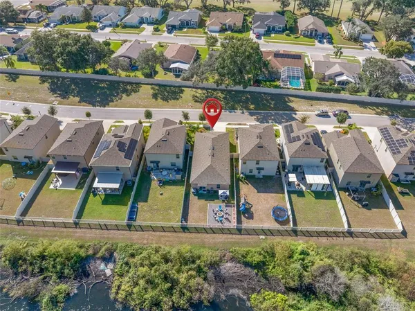 an aerial view of houses with outdoor space