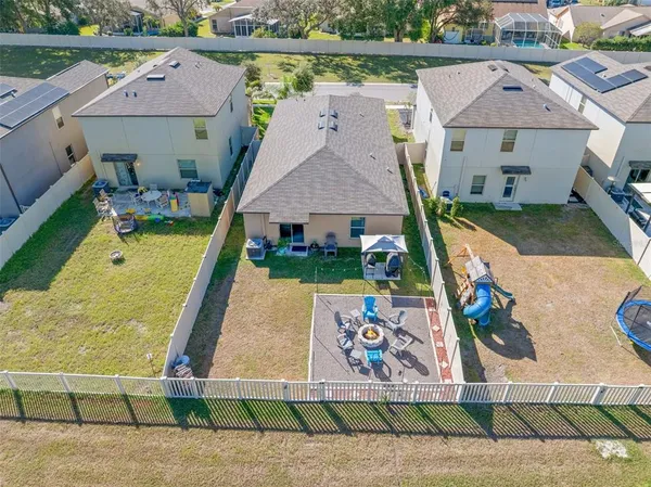 an aerial view of a house with a swimming pool