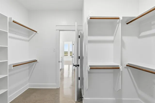 a bathroom with a shower and a glass door