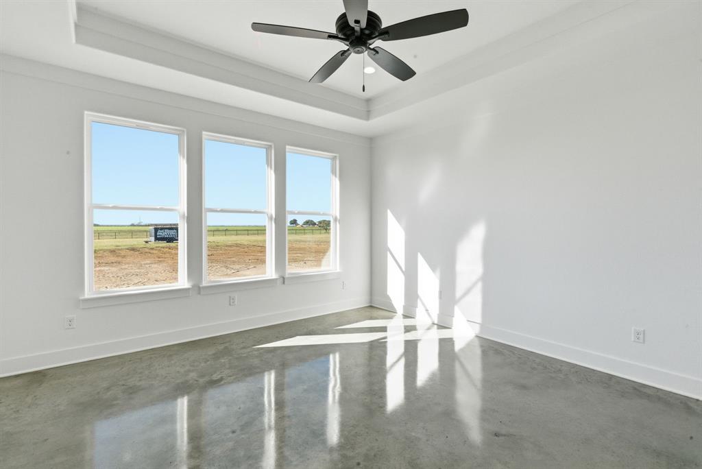 1005 Paramount Drive Cresson, TX 76035 - Photo 16 of 25 a view of empty room with wooden floor and fan