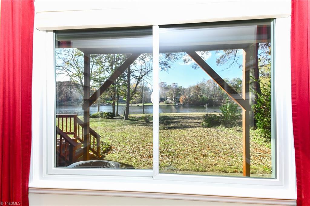 6925 Maynard Road Summerfield, NC 27358 - Photo 25 of 49 Main Level Primary Bedroom Lake view.