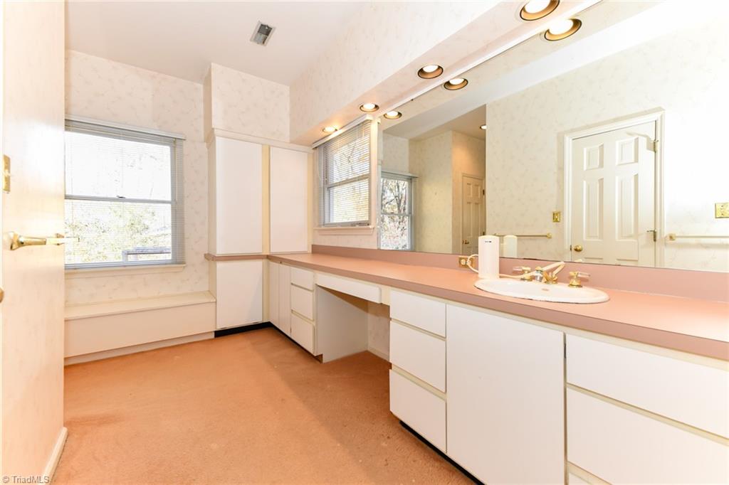 6925 Maynard Road Summerfield, NC 27358 - Photo 34 of 49 Second level full Bath vanity & dressing area.