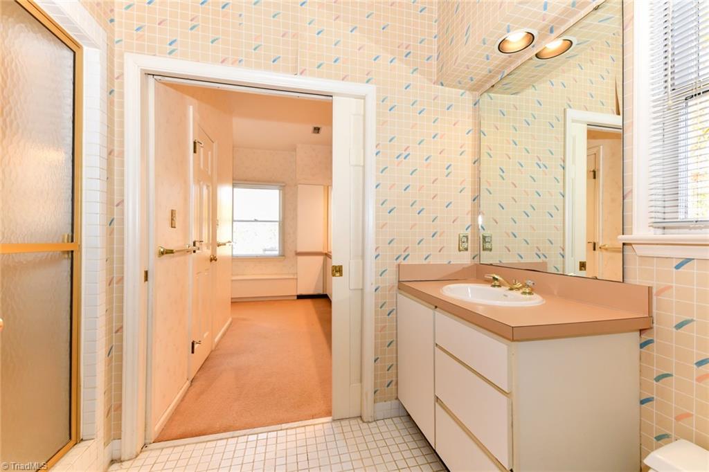 6925 Maynard Road Summerfield, NC 27358 - Photo 35 of 49 Second level vanity & separate shower.