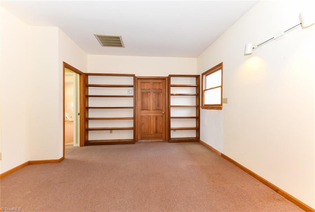 6925 Maynard Road Summerfield, NC 27358 - Photo 38 of 49 Built-in shelving in double Office.