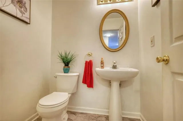 a kitchen with stainless steel appliances a refrigerator and wooden floor