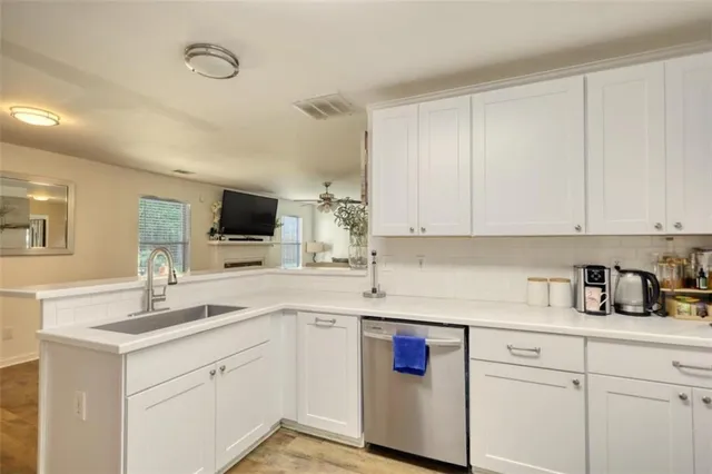 a spacious bedroom with a bed and a ceiling fan