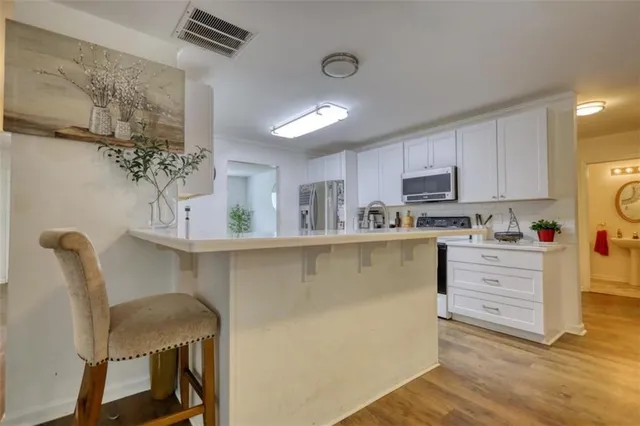 a bathroom with a tub and shower