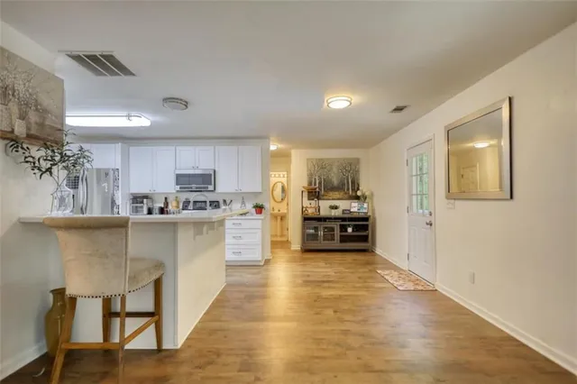 a en suite bathroom with a double sink and mirror