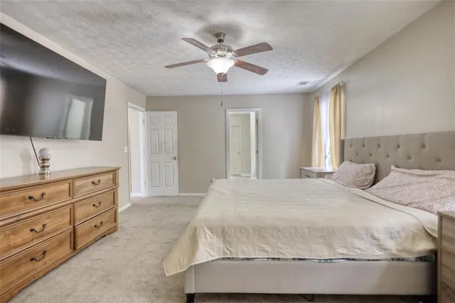 a white toilet sitting next to a bathroom sink